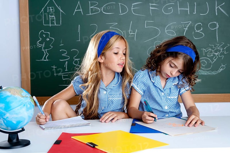 Classroom with two kids students cheating on test exam at school