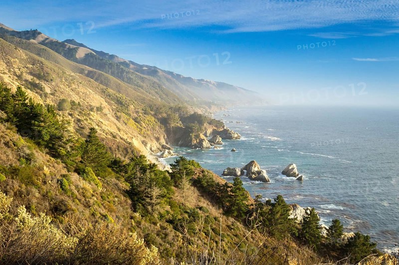 Coastal view of Big Sur landscape and scenery, with pacific ocean and rocks on the coastline during sunset.California, USA. Travel and tourism