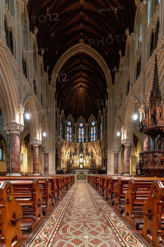 Cobh, Ireland, 15 August, 2022: vertical view of the central nave and altar inside the Cobh Cathedral, Europe