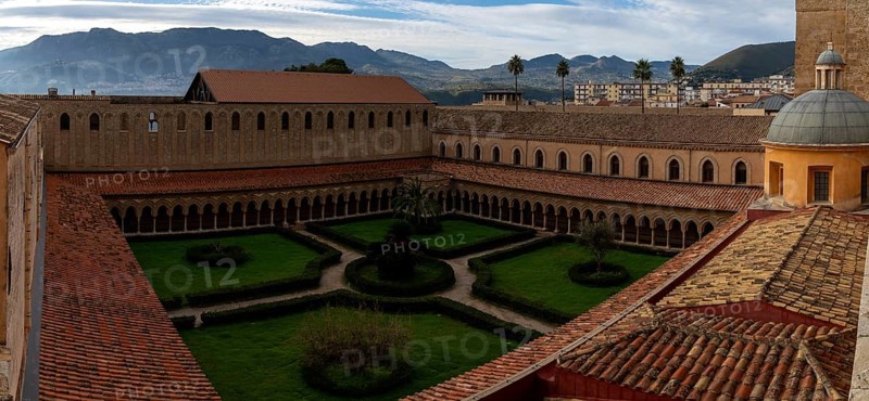 Monreale, Italy, 5 January, 2024: panorama view of the cloister and inner courtyard of the Monreale Cathedral in Sicily, Europe