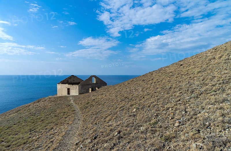 Old ruined house on the hillside above the sea. Crimea, Cape Meganom