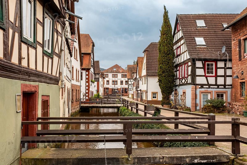Half-timbered houses on Gerbergasse by the River Queich in the old town centre of Annweiler am Trifels, Rhineland-Palatinate, Germany, Europe