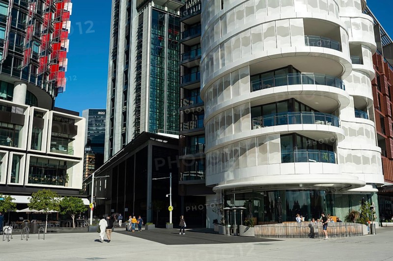 16 Sep 2018, Sydney, New South Wales, Australia, A view of modern residential buildings at Anadara Residence, office towers and restaurants along the pedestrianised Wulugul Walk in Barangaroo South. The buildings are located on the banks of Darling Harbour with the International Towers towering in the background, Oceania