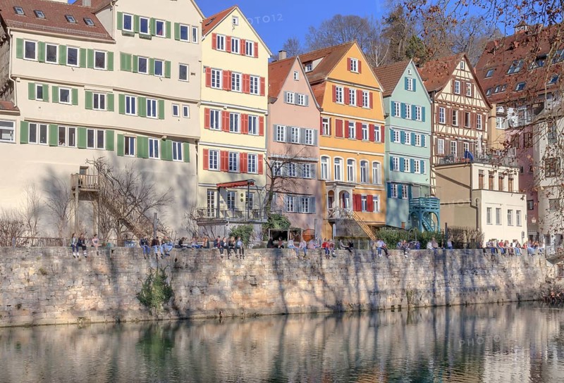 Tübingen, Neckar front, the trees of the Neckar island cast their shadows on the bank wall