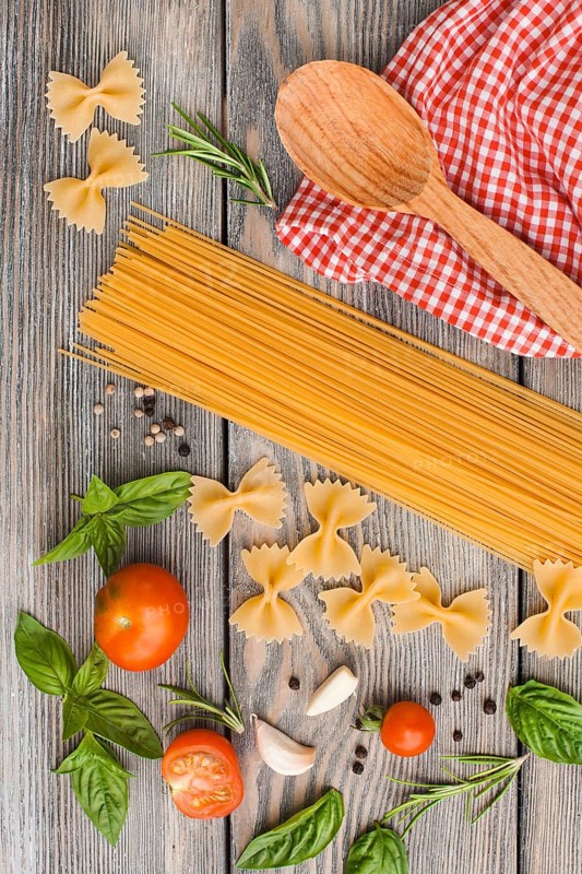 Raw Italian pasta with tomato sauce ingredients