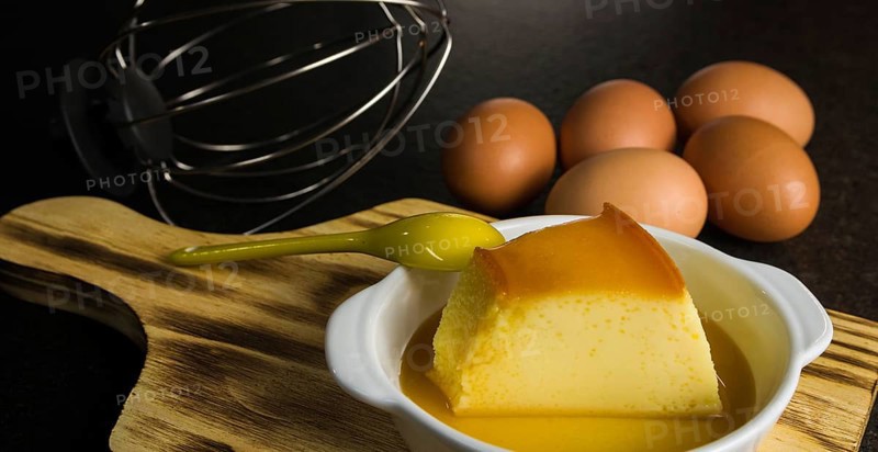 Traditional Brazilian dessert, milk pudding on dark background