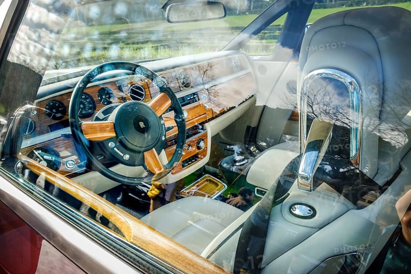 Lisbon, Portugal, Jan 20, 2024: Interior of luxury Rolls-Royce Phantom Drophead Coupe car through door window, Europe