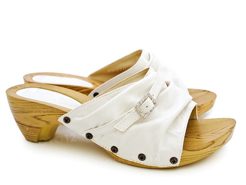 Woman's summer white shoes over white background