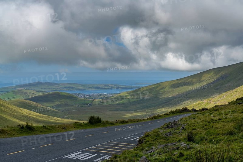 The steep and winding mountain road leading to the top of Connor Pass on the Dingle Peninsula