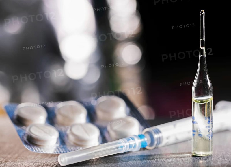Pills, Syringe And Ampoule With Vaccination On Dark Table