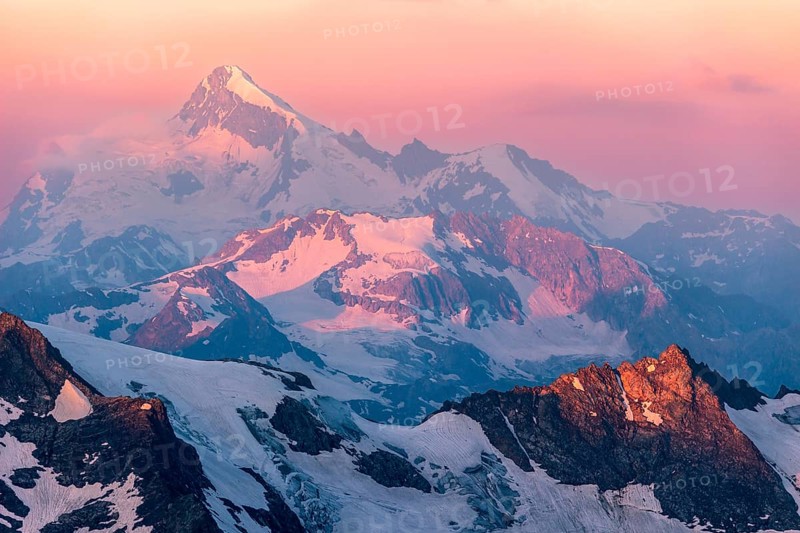 Colorful pink sunrise in mountains. Caucasus, Russia, Europe