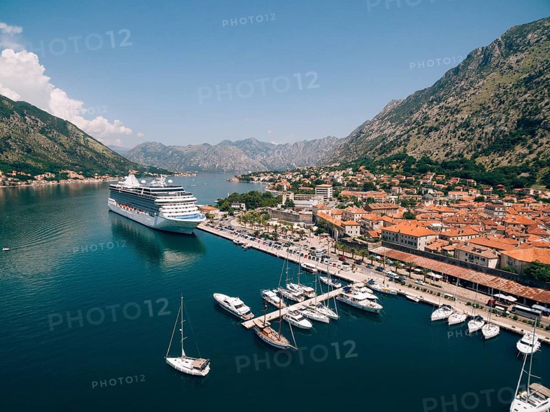 Top view of the pier with a big boat and town. Drone photo