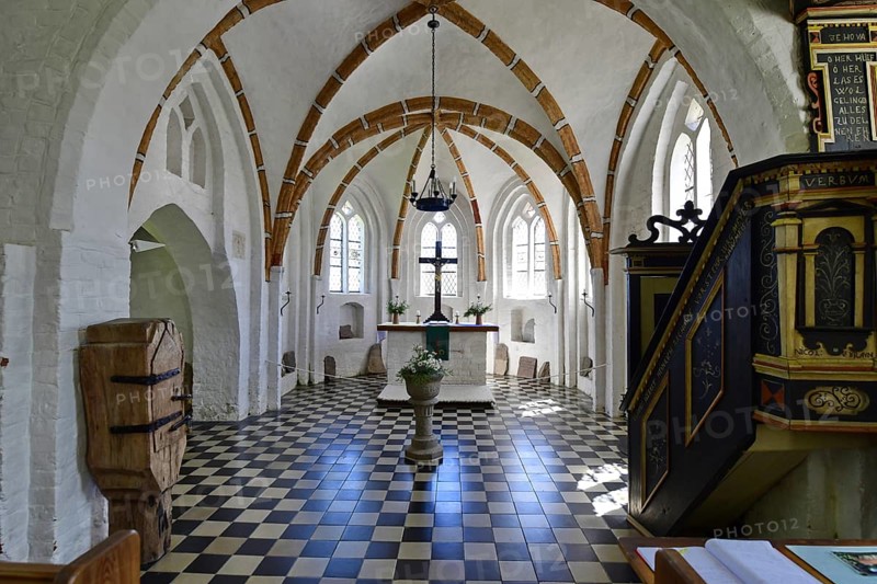 Historic church interior with pulpit and stained glass windows, suggesting silence and contemplation, Rügen (Groß Zicker)