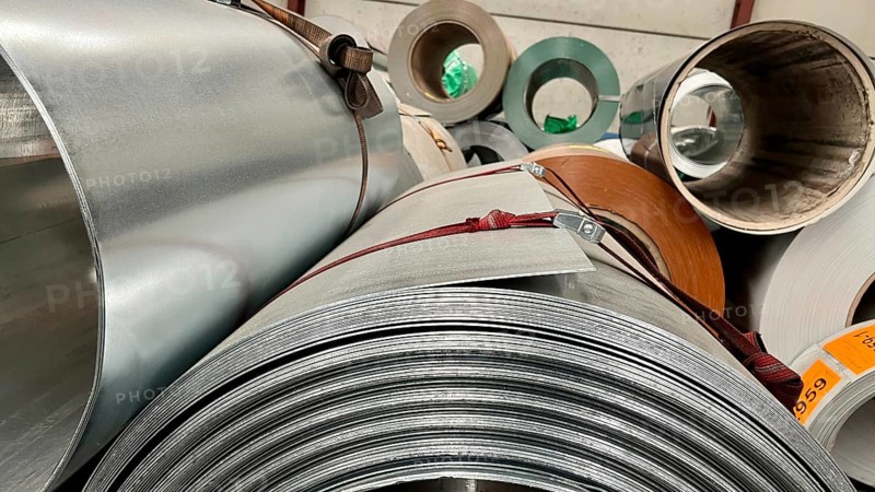 Rolls of galvanized steel sheet inside the factory or warehouse