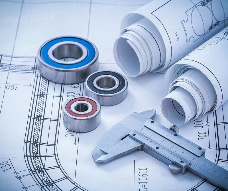 Close up image of construction drawings slide caliper rolling bearings on blueprint architecture and building concept