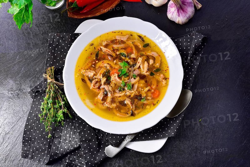 Traditional Politur-style tripe soup with beef and vegetables