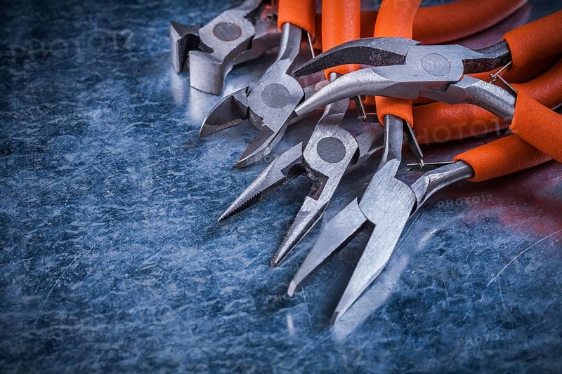 Sharp insulated electric pliers nippers horizontal version electricity concept