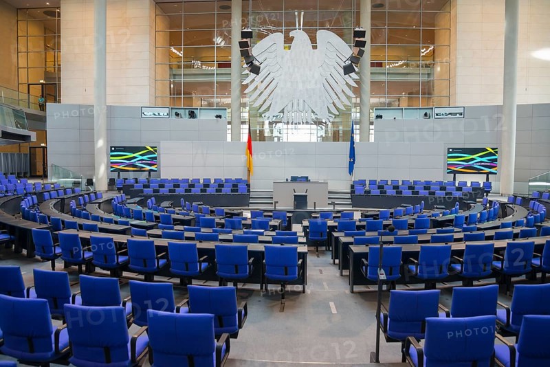 The plenary chamber of the Bundestag with many blue seats and the German flag, Reichstag building, German Bundestag, Berlin, Germany, Europe