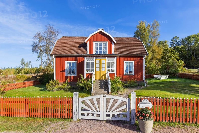Katthult, red wooden farm house with fence from Astrid Lindgren's tales about Emil of Lönneberga at Gibberyd near Rumskulla, Vimmerby, Småland, Sweden, Europe