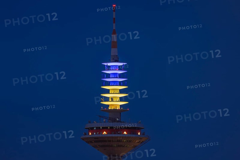The Europe Tower in Frankfurt am Main shines in the Ukrainian national colours yellow and blue on the evening of 24.02.2024. Exactly two years ago, on 24 February 2022, Russia launched a war of aggression against Ukraine, Frankfurt am Main, Hesse, Germany, Europe