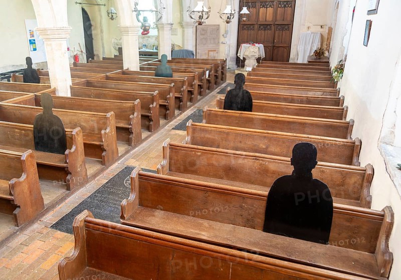 First World War remembrance figures of soldiers sitting in church pews, Framsden, Suffolk, England, UK