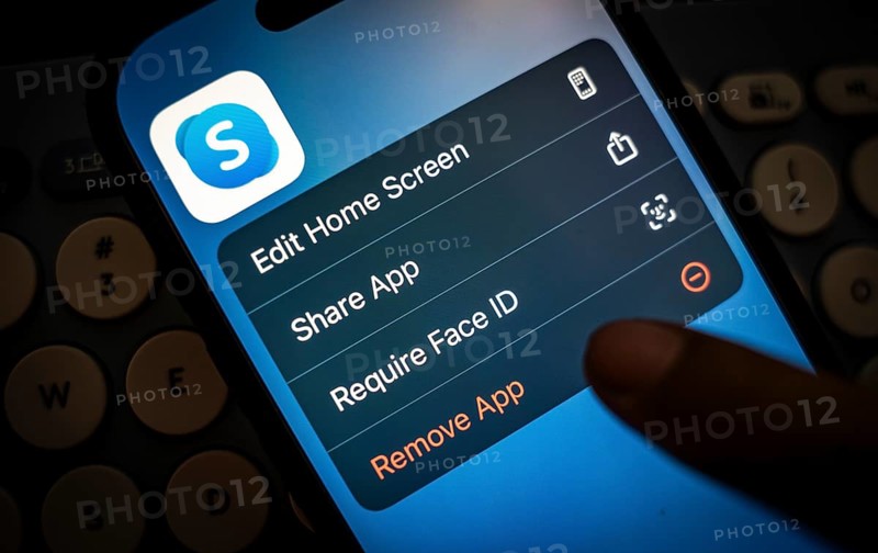 In this photo illustration, a person holds a mobile phone displaying Skype application, in Guwahati, India on 3 March 2025. Skype is shutting down in May 2025, and Microsoft is moving users to Teams