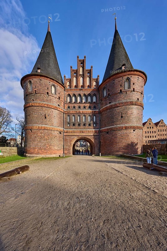 City gate, historic brick building, footpath made of sand, Holstentorplatz, Hanseatic city of Lübeck, independent city, Schleswig-Holstein, Germany, Europe