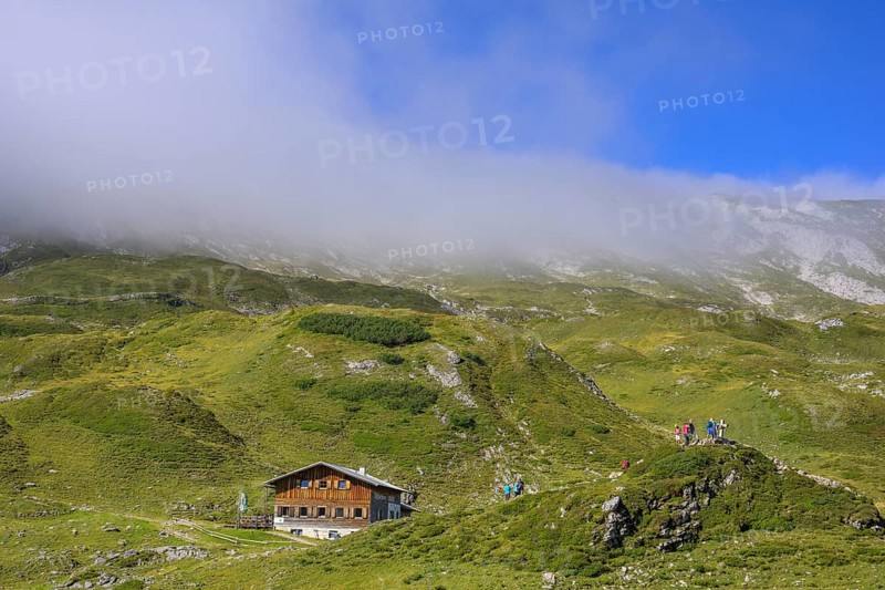 Giglachseehütte and fog over the mountain ridge, Schladming, Styria, Austria, Europe