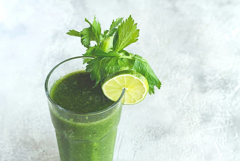 Glass with green smoothie, celery and spinach, apple and kiwi, cucumber, vegetable smoothie, breakfast, homemade, no people