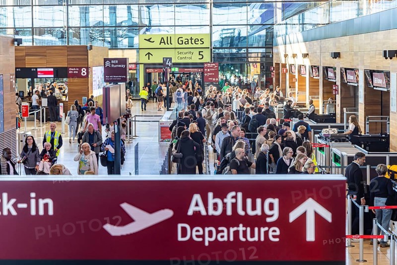 Berlin-Brandenburg BER Airport. Passengers in Terminal 1 waiting for check-in and security control in front of departure. Berlin, Germany, Europe