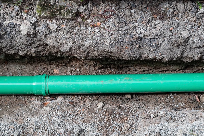 Newly laid green sewage pipe in a trench, Stuttgart, Baden-Württemberg