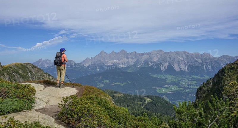 Woman looking towards the Dachstein massif, Schladming, Styria, Austria, Europe