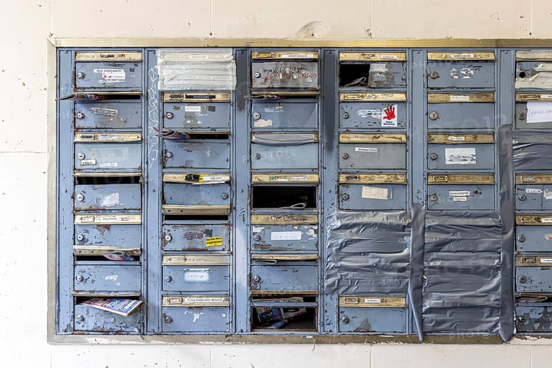 Doorbell sign, broken letterbox system on a dilapidated block of flats in Stuttgart, Baden-Württemberg, Germany, Europe
