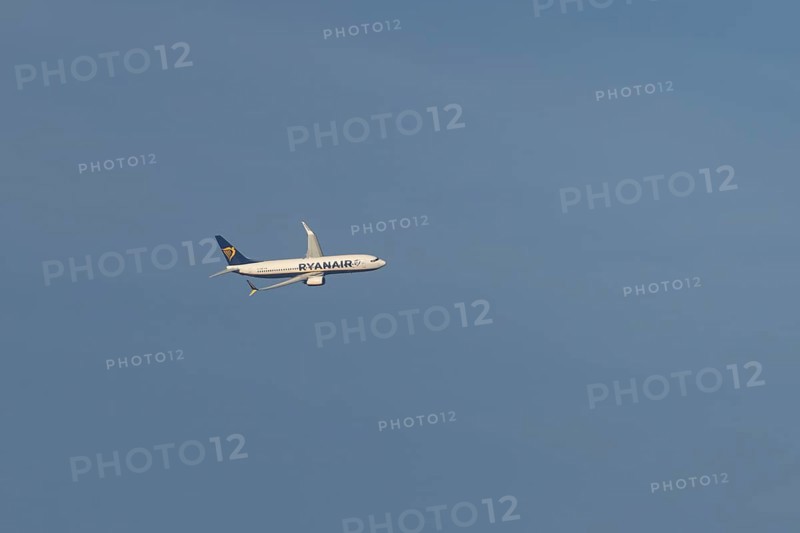Boeing 737 jet passenger aircraft of Ryanair flying in a blue sky, Rome, Italy, Europe