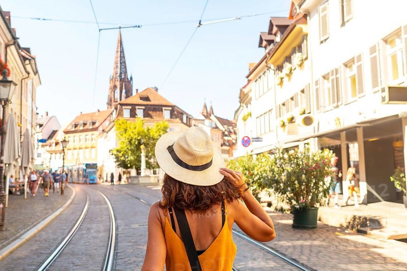 Walking past the Freiburg Minster in the city of Freiburg im Breisgau, Germany, Europe