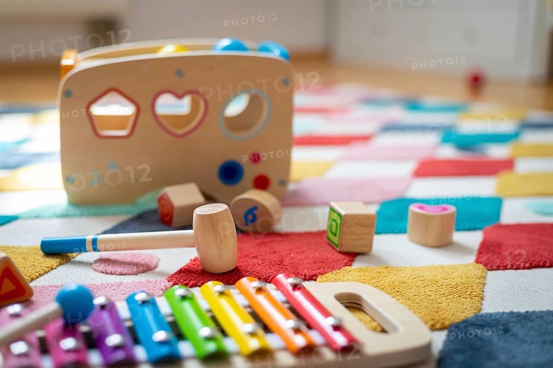 Young child toy concept: Close up of stylish wooden toddler toy in nursery