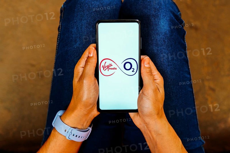 In this photo illustration, the Virgin Media O2 logo is displayed on a smartphone screen