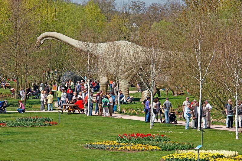 Visitors, dinosaur statue, Tulip Festival, garden show, Kaiserslautern, Rhineland-Palatinate, dinosaurs, Germany, Europe