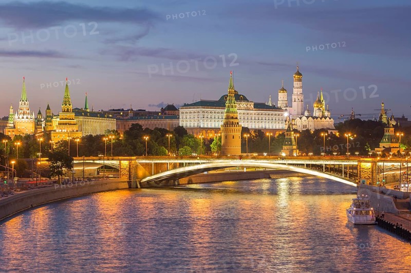 Illuminated Moscow Kremlin and Moscow River with bridge at night. Russia