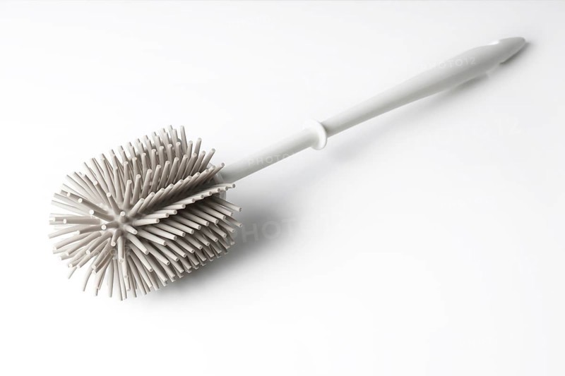 modern toilet brush with silicone bristles on white background