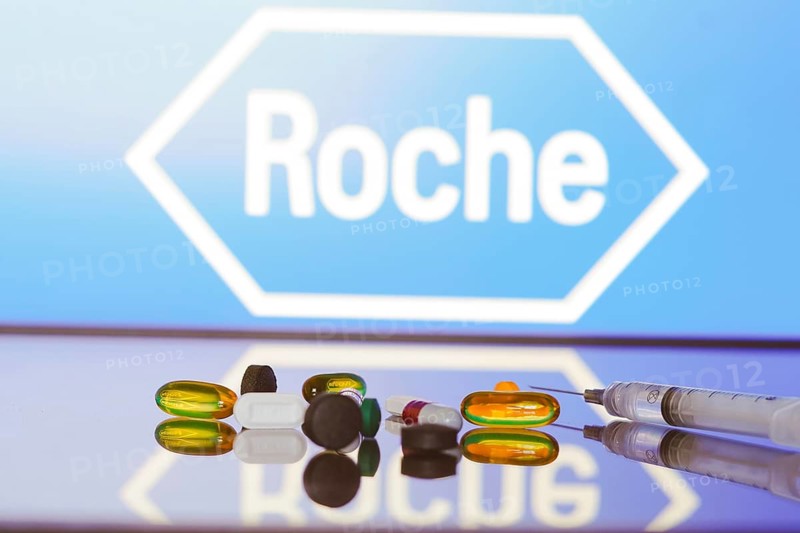 May 27, 2024, Brazil. In this photo illustration, the Hoffmann?La Roche logo is displayed on screen in the background with pills and medical bottle and syringe