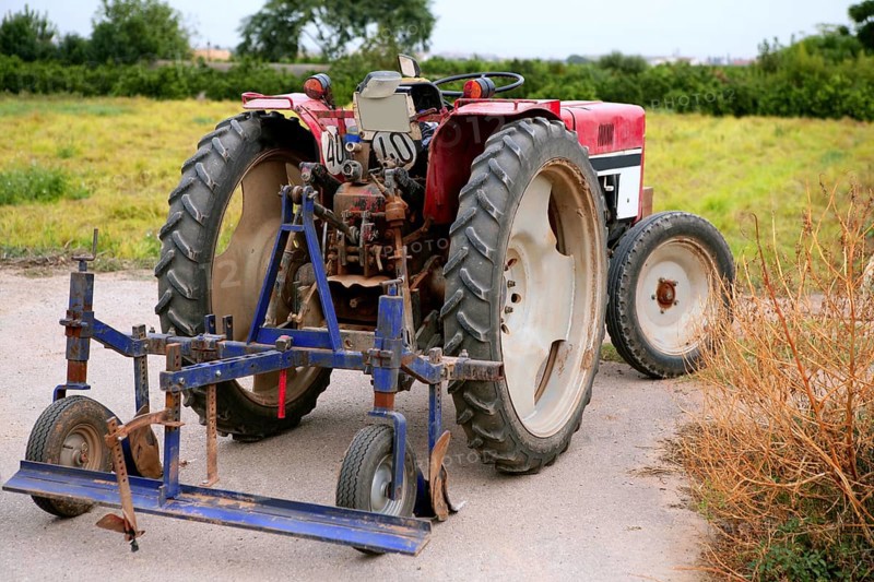 Agriculture aged red tractor retro vintage machine