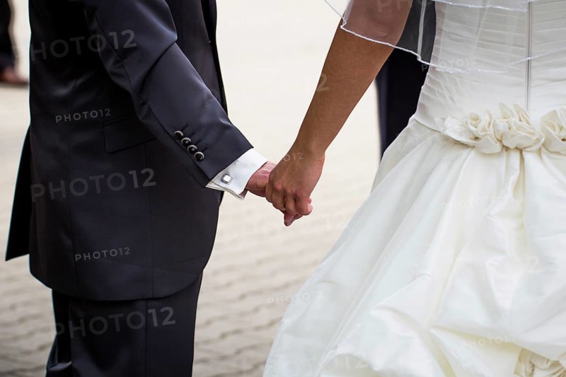 Couple holding hands