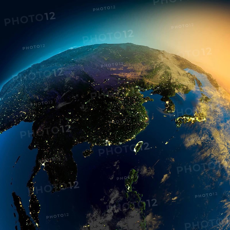 Night view of Asia from the satellite to the glowing lights of towns on the sunrise from the east