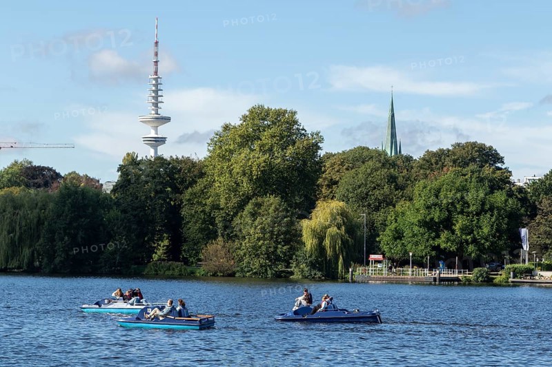 Leisure activities in summer, pedal boats against a blue sky on the Alster, with the Telemichel television tower behind, Hamburg, Germany, Europe