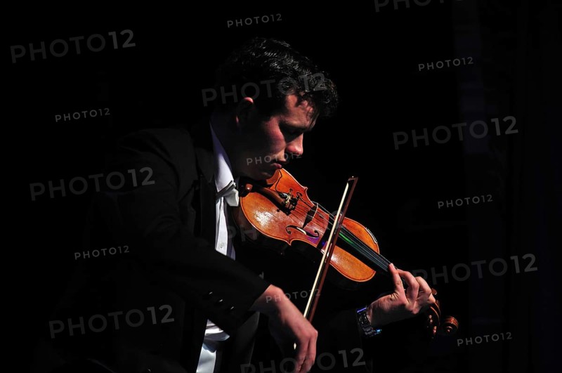 Violinists performing in live concert
