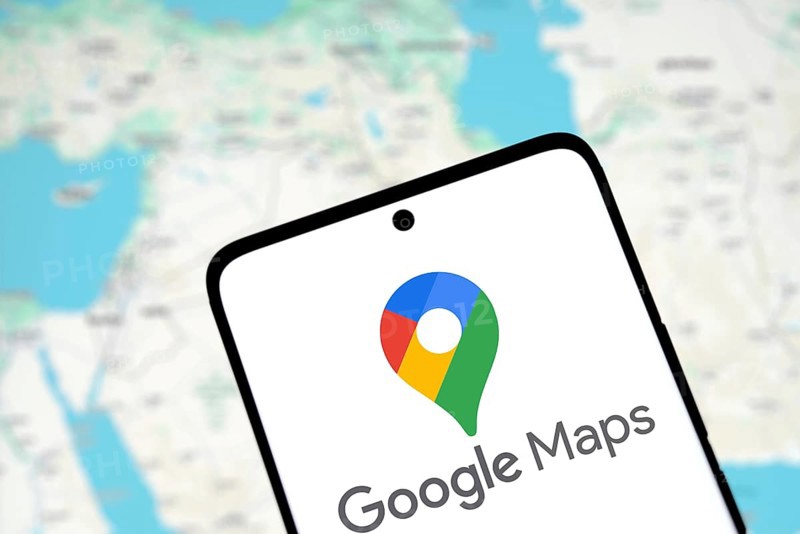 Google maps logo is displayed on smartphone