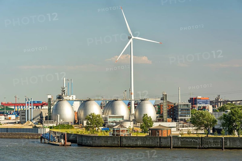 Gas storage reservoir and large wind turbine in the harbour area in Hamburg, Germany, Europe