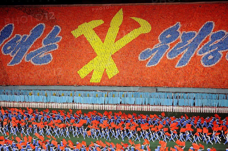 08.08.2012, Pyongyang, North Korea, Asia, Dancers and acrobats at the Arirang Festival at the Rungrado May Day Stadium in Pyongyang. The majority of the performances during the mass event are performed by dancers from the field of rhythmic gymnastics, who have been trained and rehearsed for months in advance. An estimated 100, 000 dancers, acrobats and participants celebrate their patriotism and the socialist unity of the Juche ideology. The event takes place every year in the warm summer months from July to September, Asia