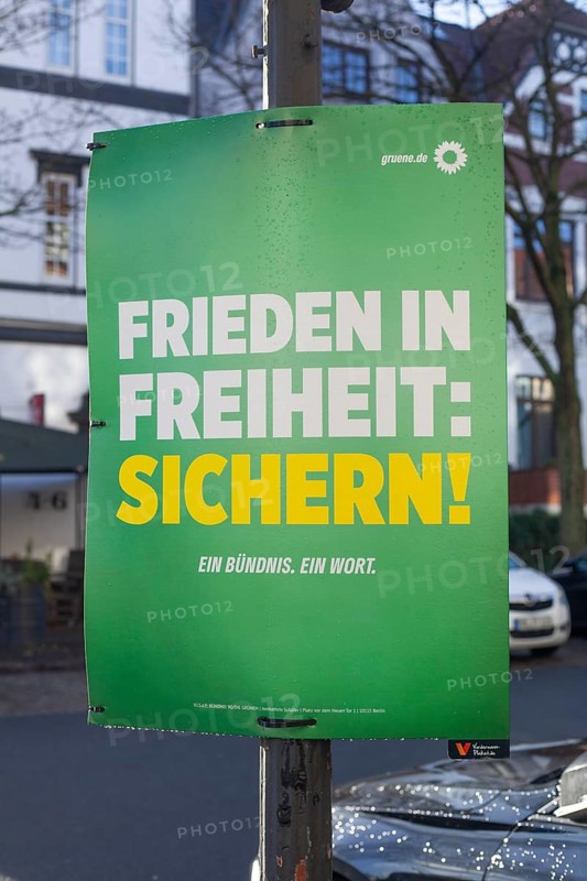 Election poster of the party Bündnis 90 Die Grünen for the Bundestag election 2025 with the text Frieden in Freiheit sichern, Bremen, Germany, Europe